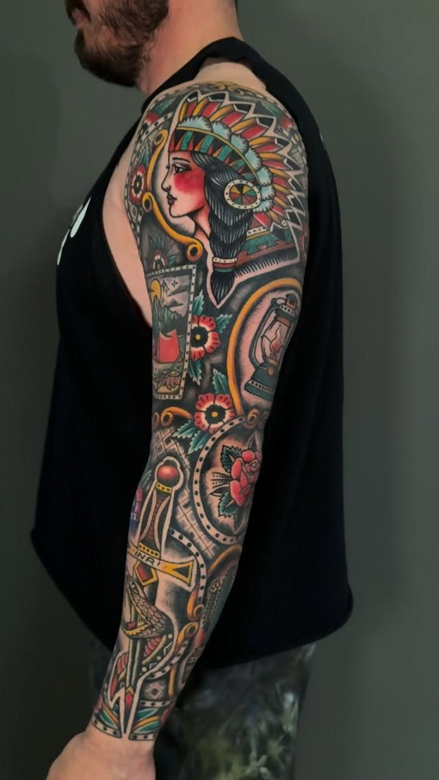 Full arm sleeve tattoo in American traditional style featuring a Native American woman.