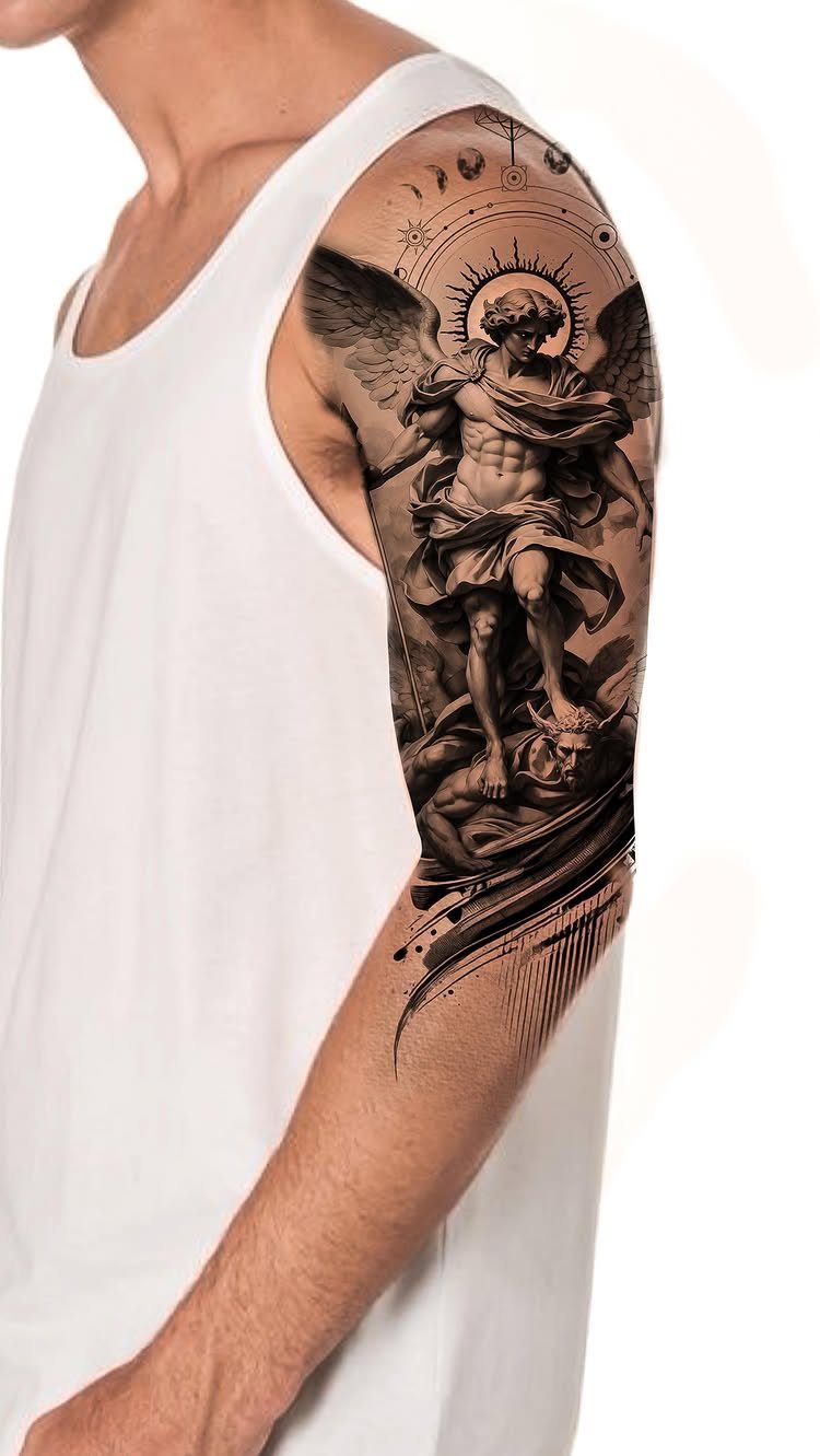 Classical angel statue tattoo on a man's arm defeating a demon