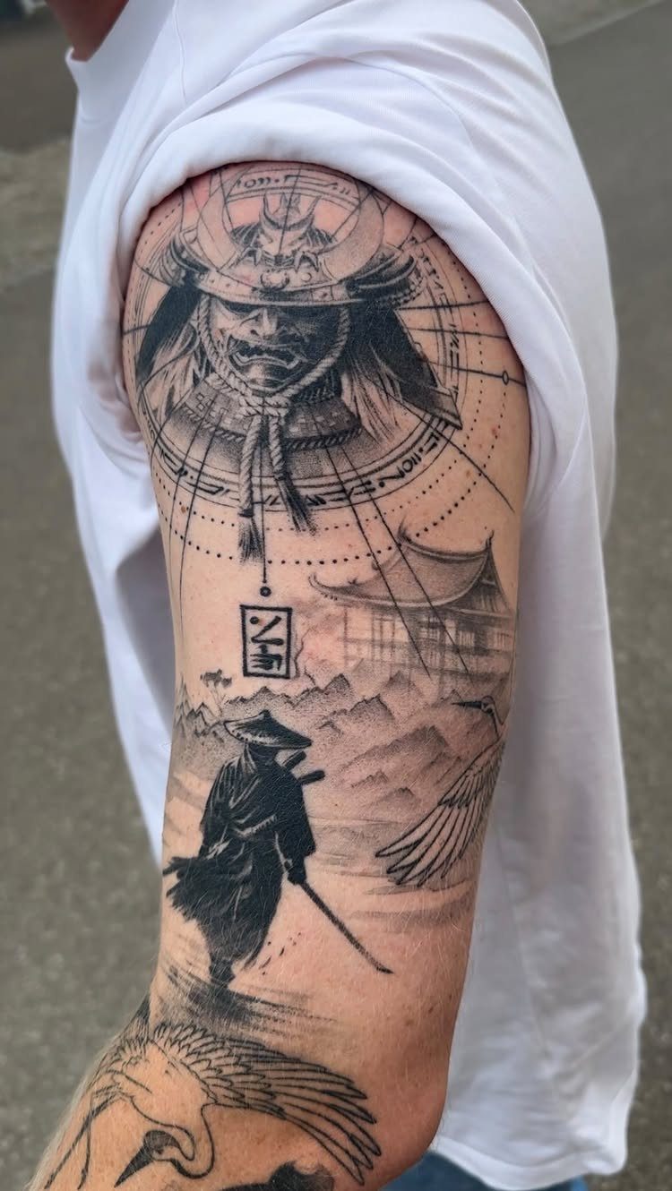 Detailed black and grey realism tattoo of samurai and landscapes on an upper arm.