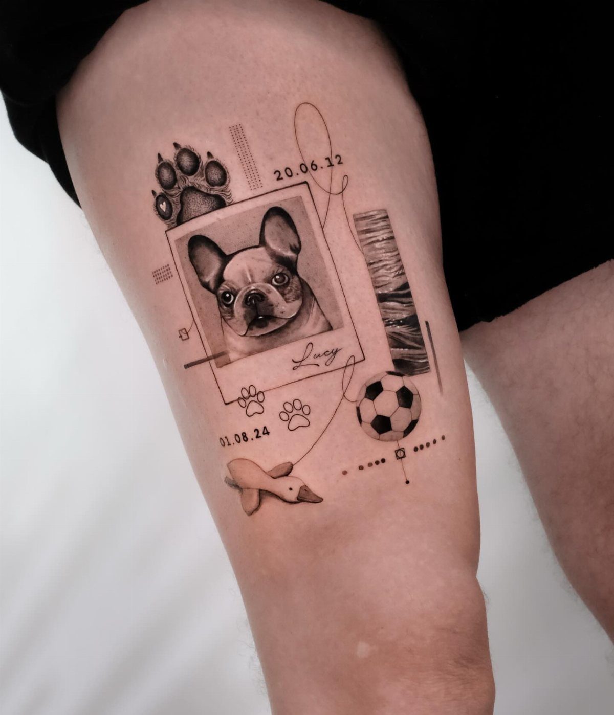 Dog memorial tattoo on a thigh featuring a French Bulldog portrait and paw prints.