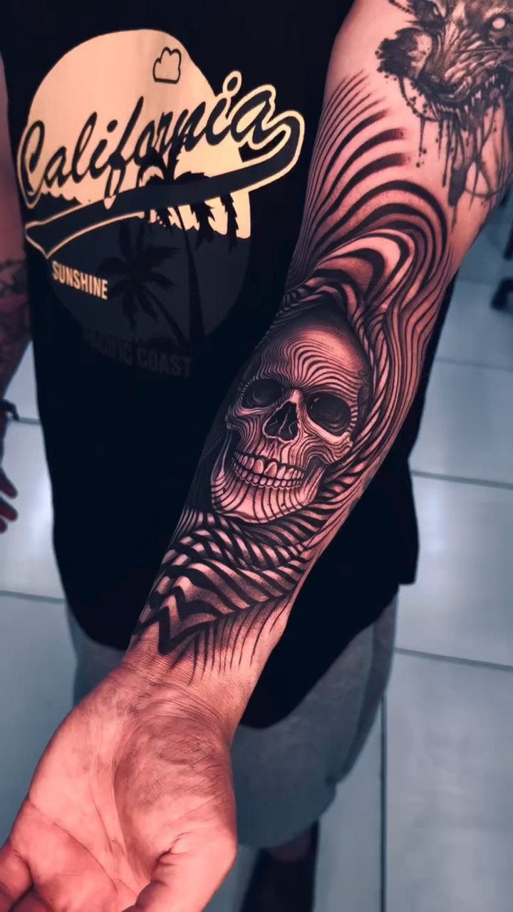 Geometric skull tattoo on a forearm created with flowing black parallel lines