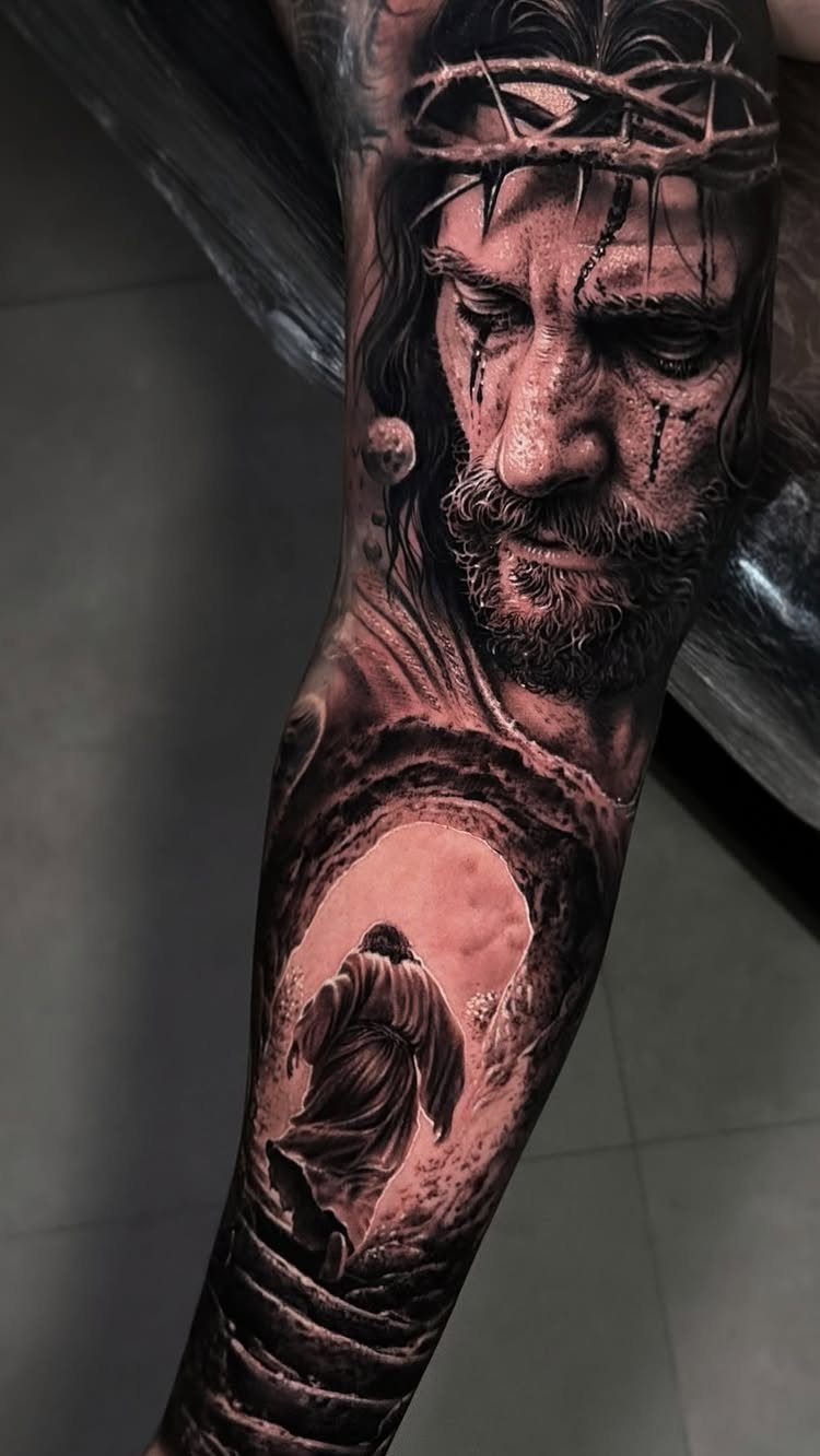 Detailed black and grey tattoo of Jesus with a crown of thorns on arm