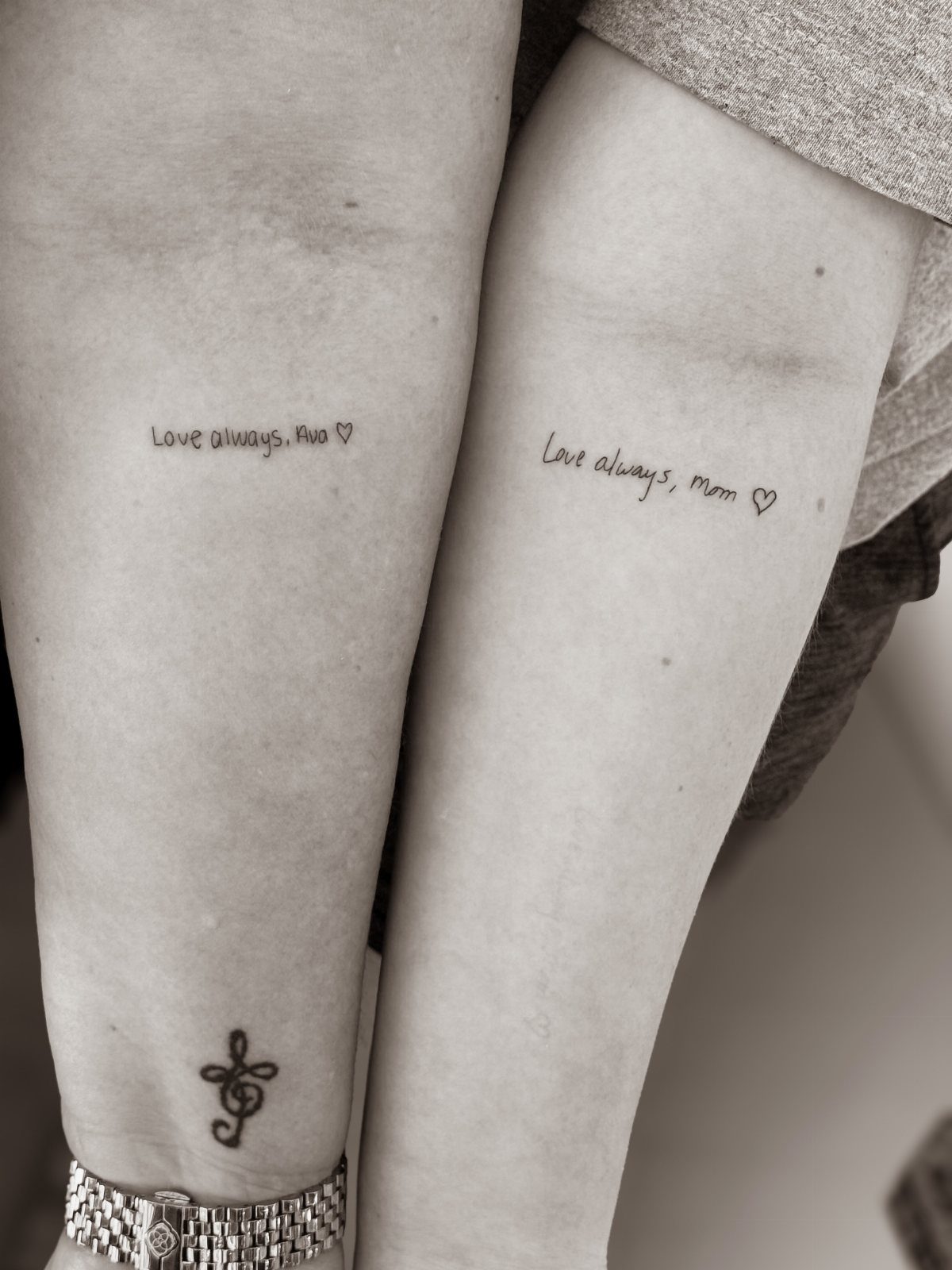 Matching arm tattoos with the phrases Love always, Ava and Love always, Mom.