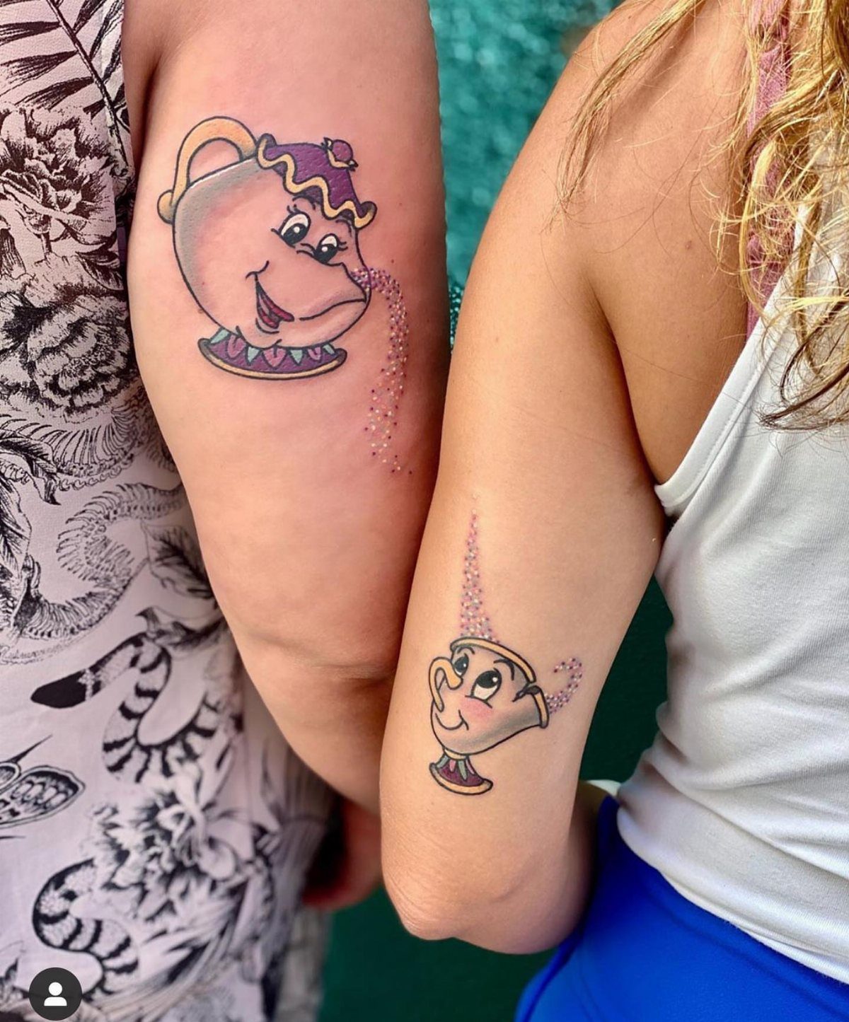 Matching tattoos of a teapot and teacup on two people's arms.