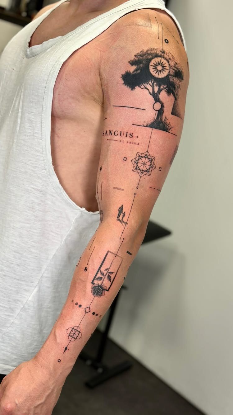 Black ink tattoo of a stylized tree and geometric symbols on a man's arm.