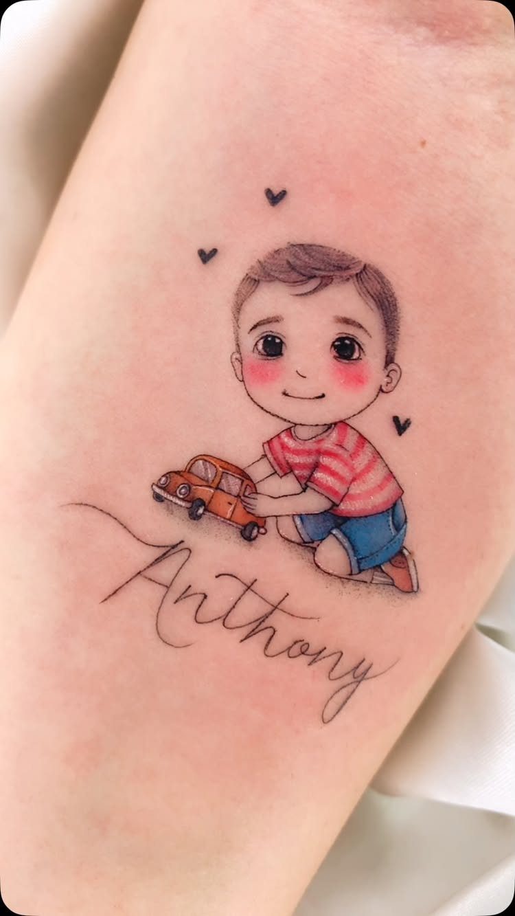 Colorful tattoo of a small boy playing with a toy car and name Anthony