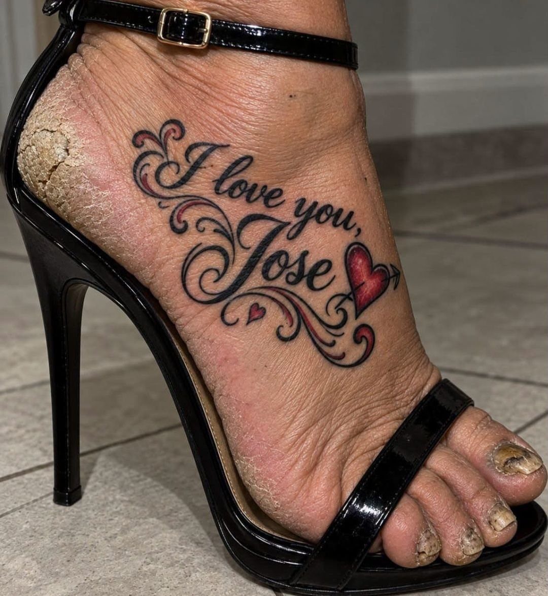 Foot tattoo with cursive text reading I love you Jose and red hearts