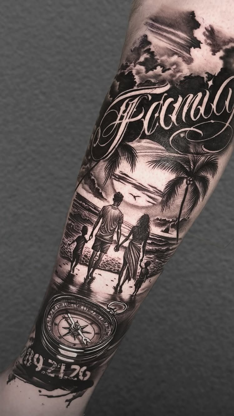 Detailed black and grey arm tattoo featuring a family on a beach and a compass.