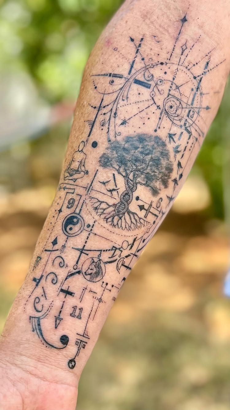 Detailed black ink tattoo of a tree of life with geometric elements on forearm