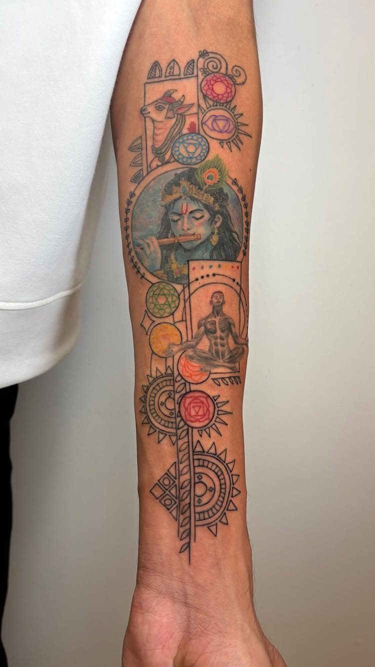 Colorful Hindu themed tattoo on a man's forearm featuring Krishna and mandalas