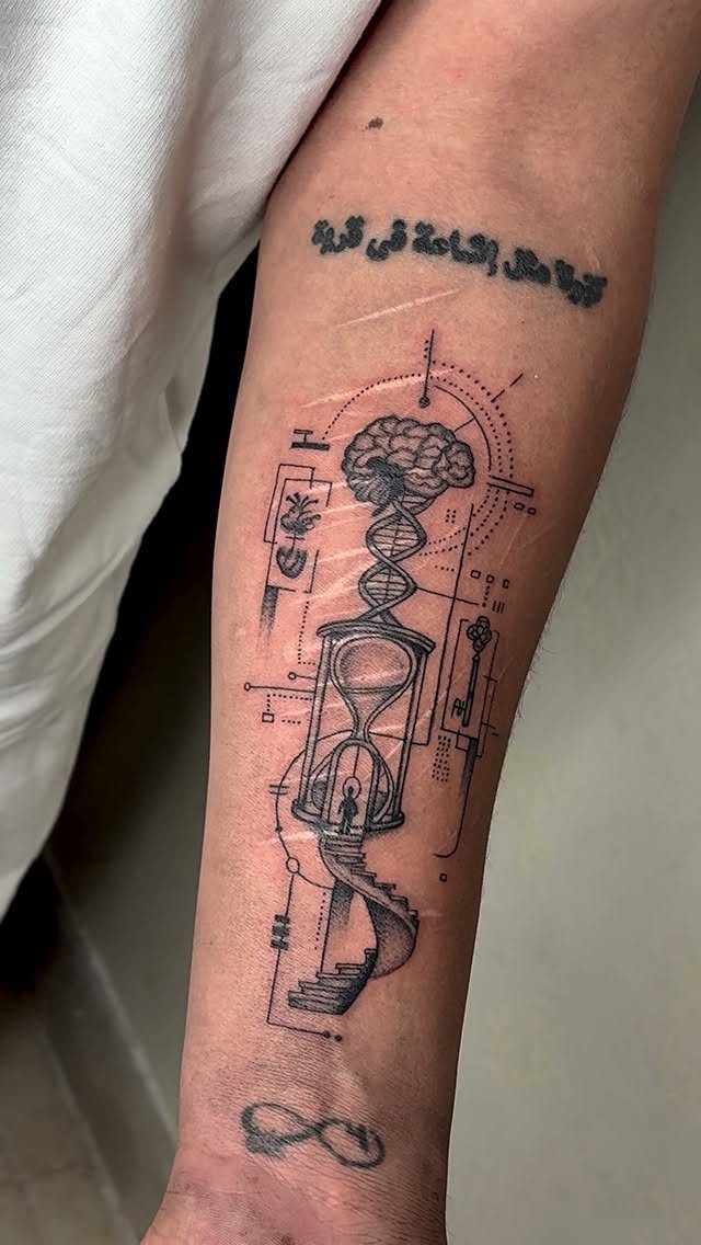 Hourglass tattoo on a forearm featuring a brain, DNA helix, and spiral staircase.