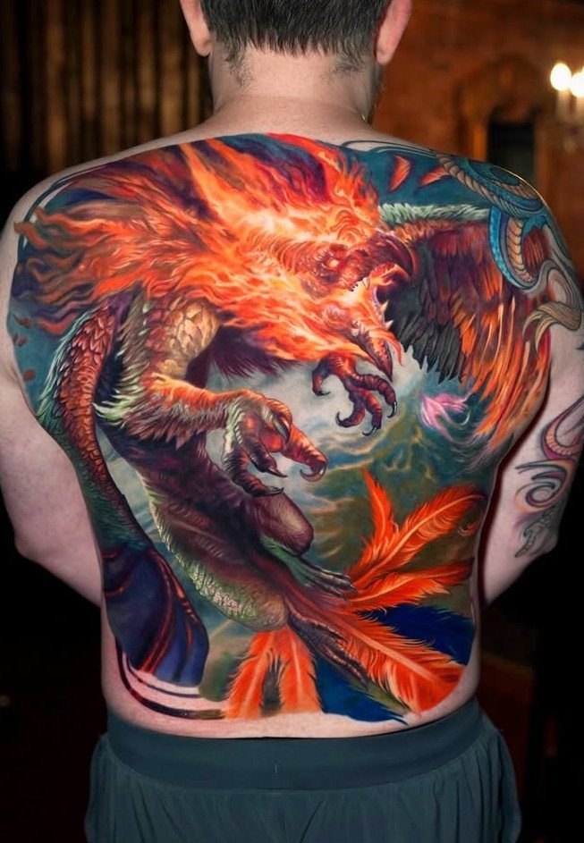Phoenix tattoo in vibrant orange and red covering a man's entire back.