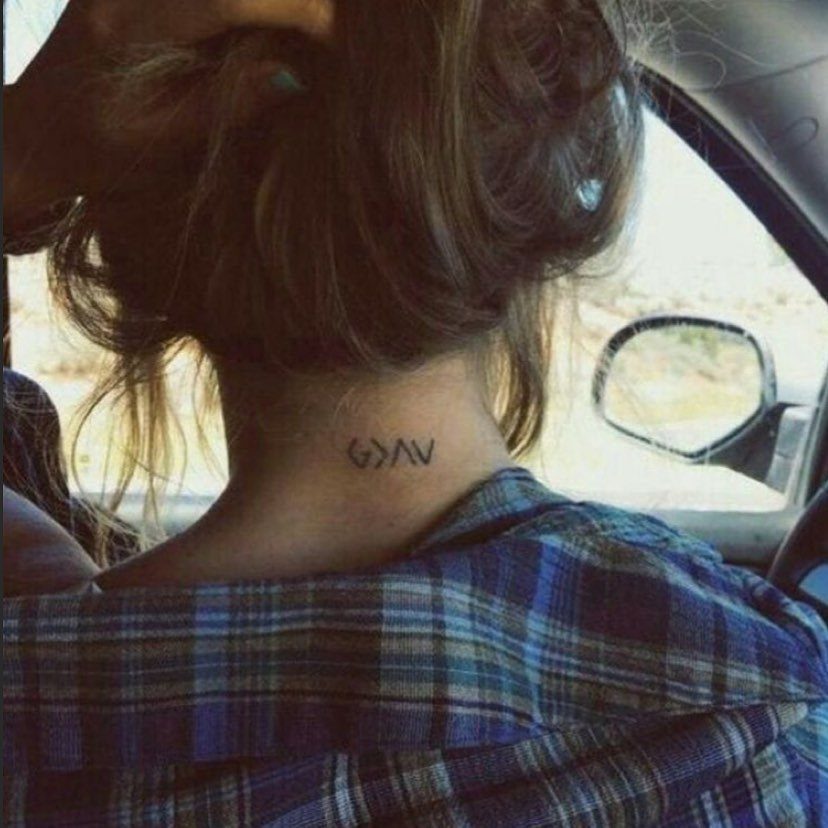Woman with a small God is Greater Than the Highs and Lows tattoo